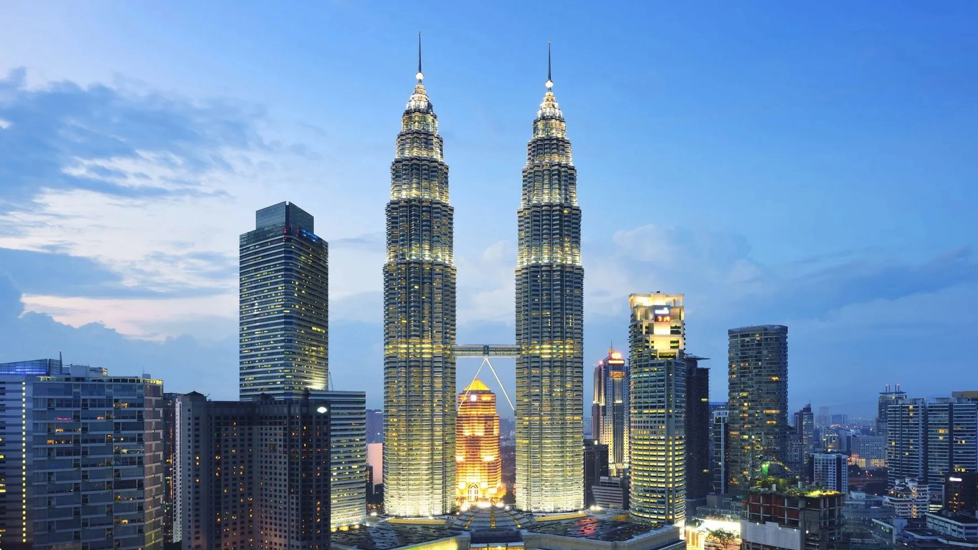 View of the Petronas Twin Towers in Kuala Lumpur, Malaysia, against a clear sky