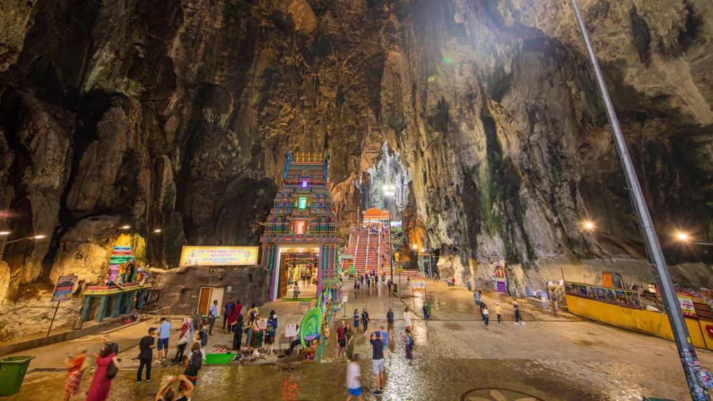 "The magnificent Batu Caves in Malaysia, featuring the towering statue of Lord Murugan"